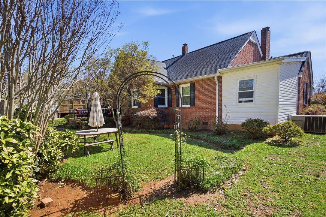 310 Retreat Street Westminster, SC 29693 - Photo 33 of 46 This residence features a spacious private yard, offering a tranquil outdoor retreat for leisure and enjoyment.