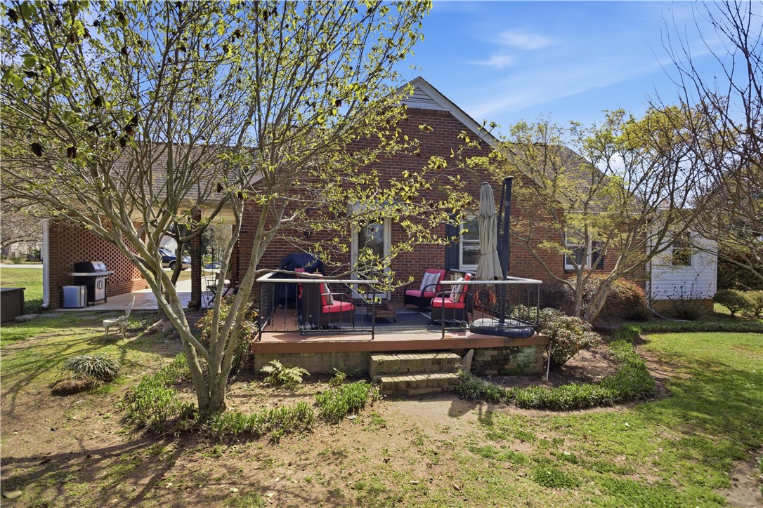 310 Retreat Street Westminster, SC 29693 - Photo 37 of 46 This charming brick home features a cozy back patio, perfect for outdoor enjoyment and entertaining.