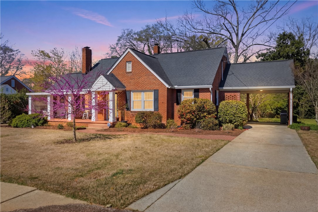 310 Retreat Street Westminster, SC 29693 - Photo 4 of 46 This classic brick residence presents charming curb appeal, featuring a welcoming porch and convenient carport.