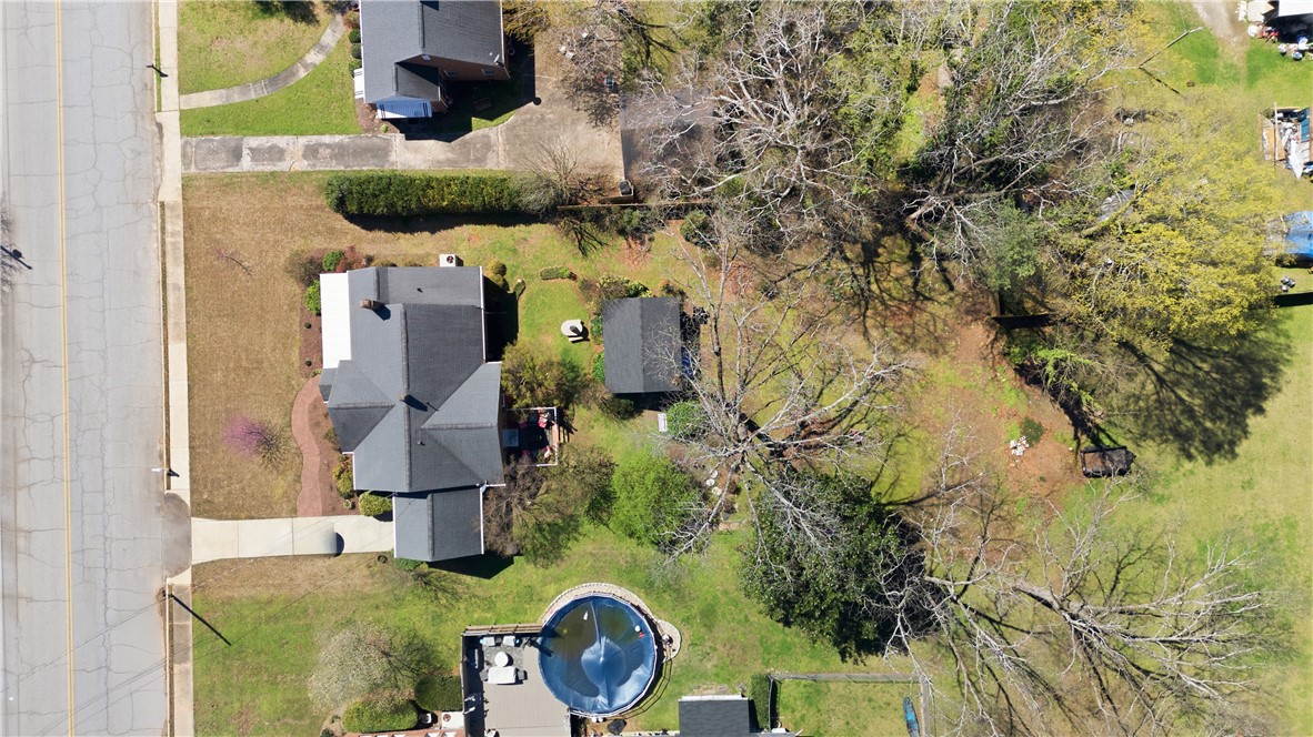 310 Retreat Street Westminster, SC 29693 - Photo 43 of 46 An aerial view showcases a residential property featuring a home, outbuilding, and refreshing pool.