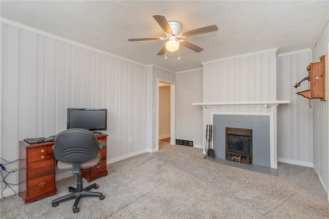 1218 Bolt Drive Anderson, SC 29621 - Photo 23 of 46 A cozy living space awaits with soft carpet and a charming fireplace.