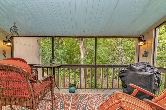 a view of a chairs and table in the balcony