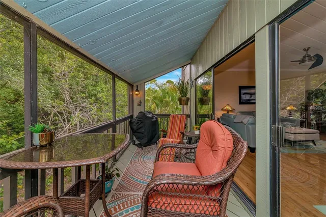 a balcony view with a seating space