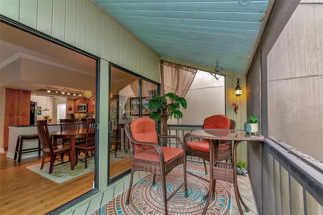 a view of a two chairs in the balcony