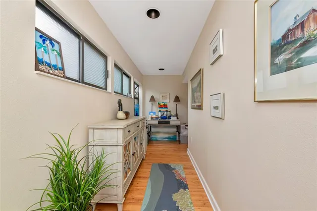 a bedroom with a large bed and a flat screen tv