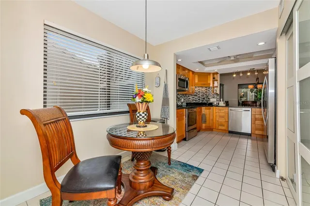 a view of a dining room with furniture and window