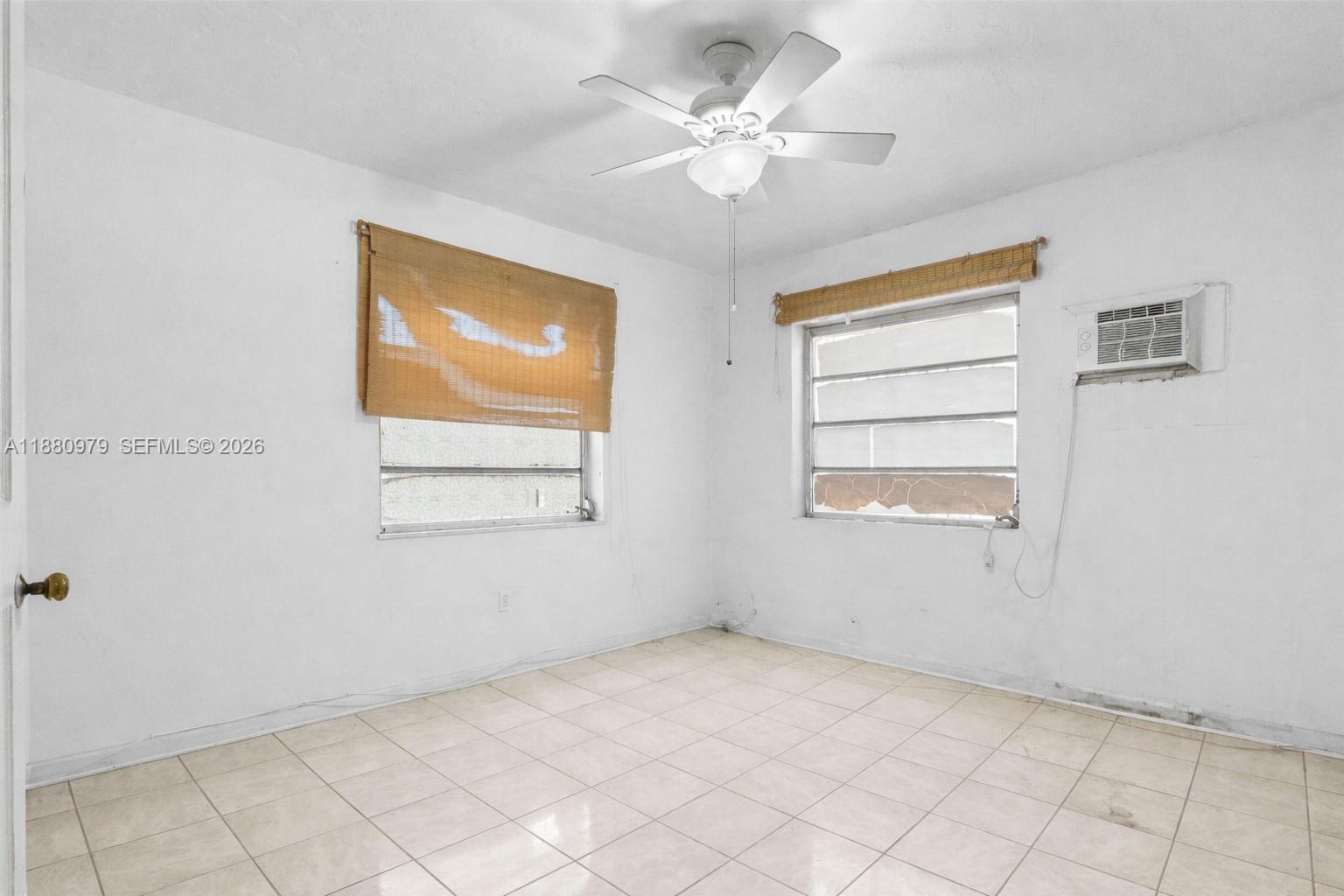 1345 Southwest 7th Street Miami, FL 33135 - Photo 16 of 37 a view of an empty room with a window