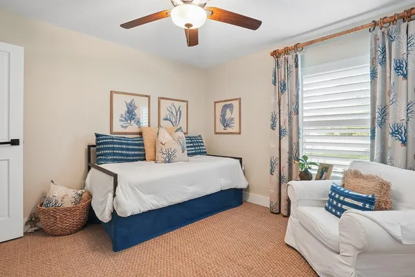 a bedroom with a bed and balcony