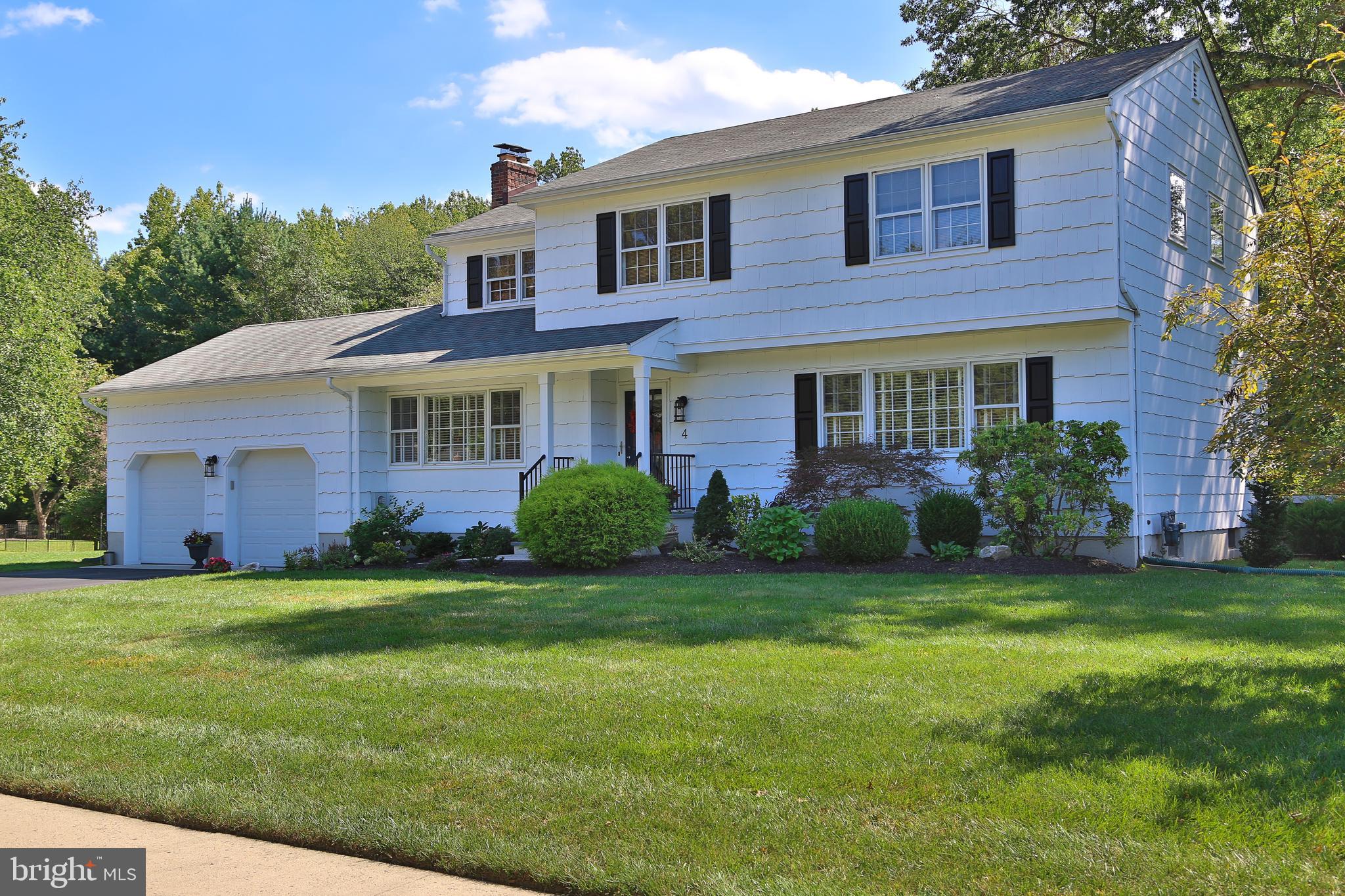 4 Indian Run Road Princeton Junction, NJ 08550 - Photo 2 of 43 a front view of a house with a garden