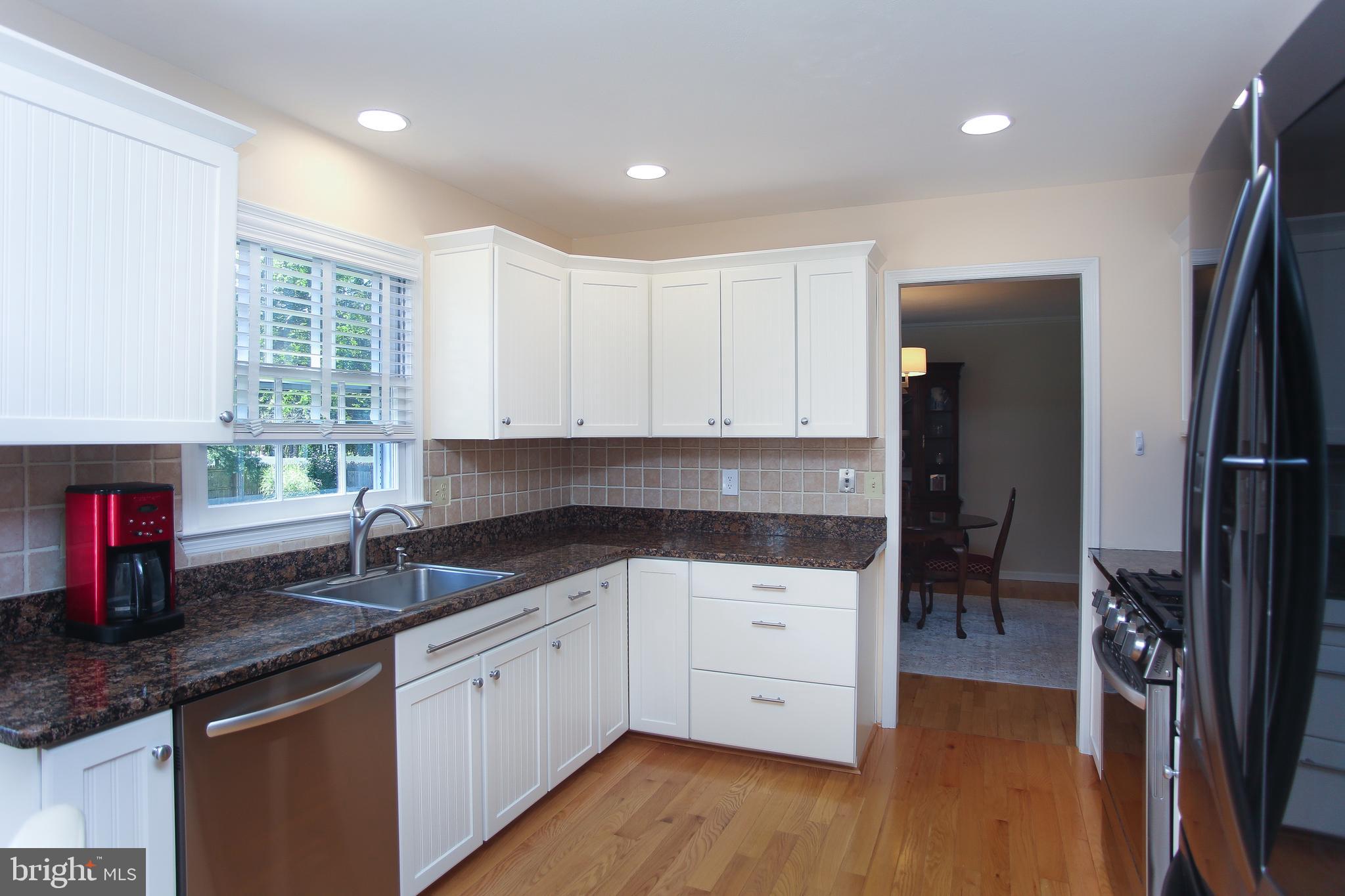 4 Indian Run Road Princeton Junction, NJ 08550 - Photo 12 of 43 a kitchen with a sink dishwasher a refrigerator and a stove