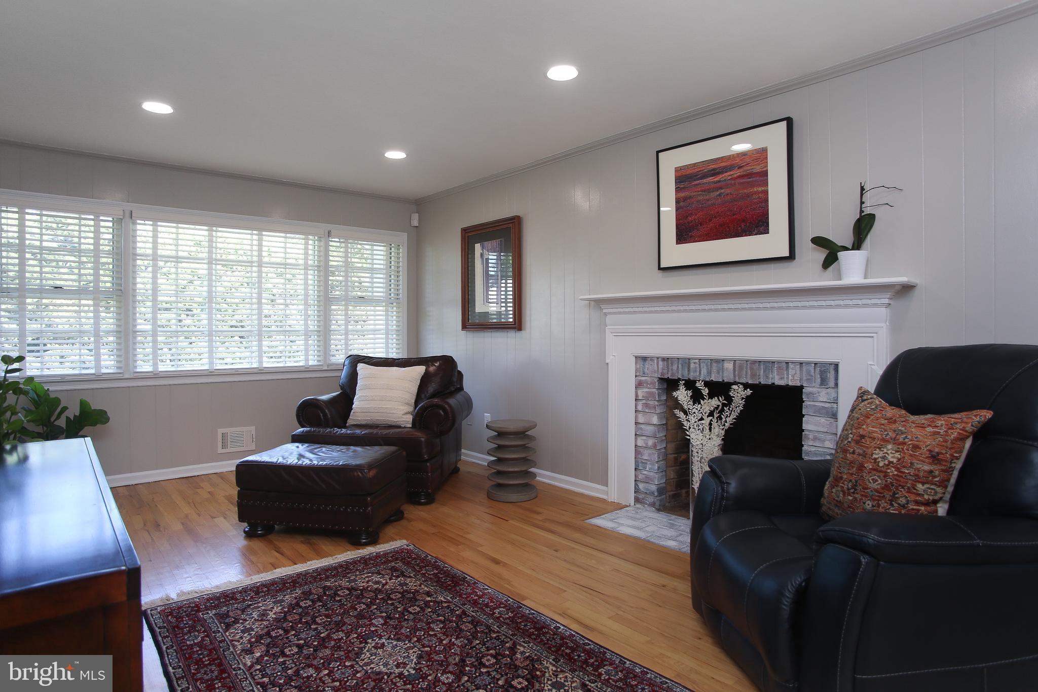 4 Indian Run Road Princeton Junction, NJ 08550 - Photo 13 of 43 a living room with furniture and a fireplace