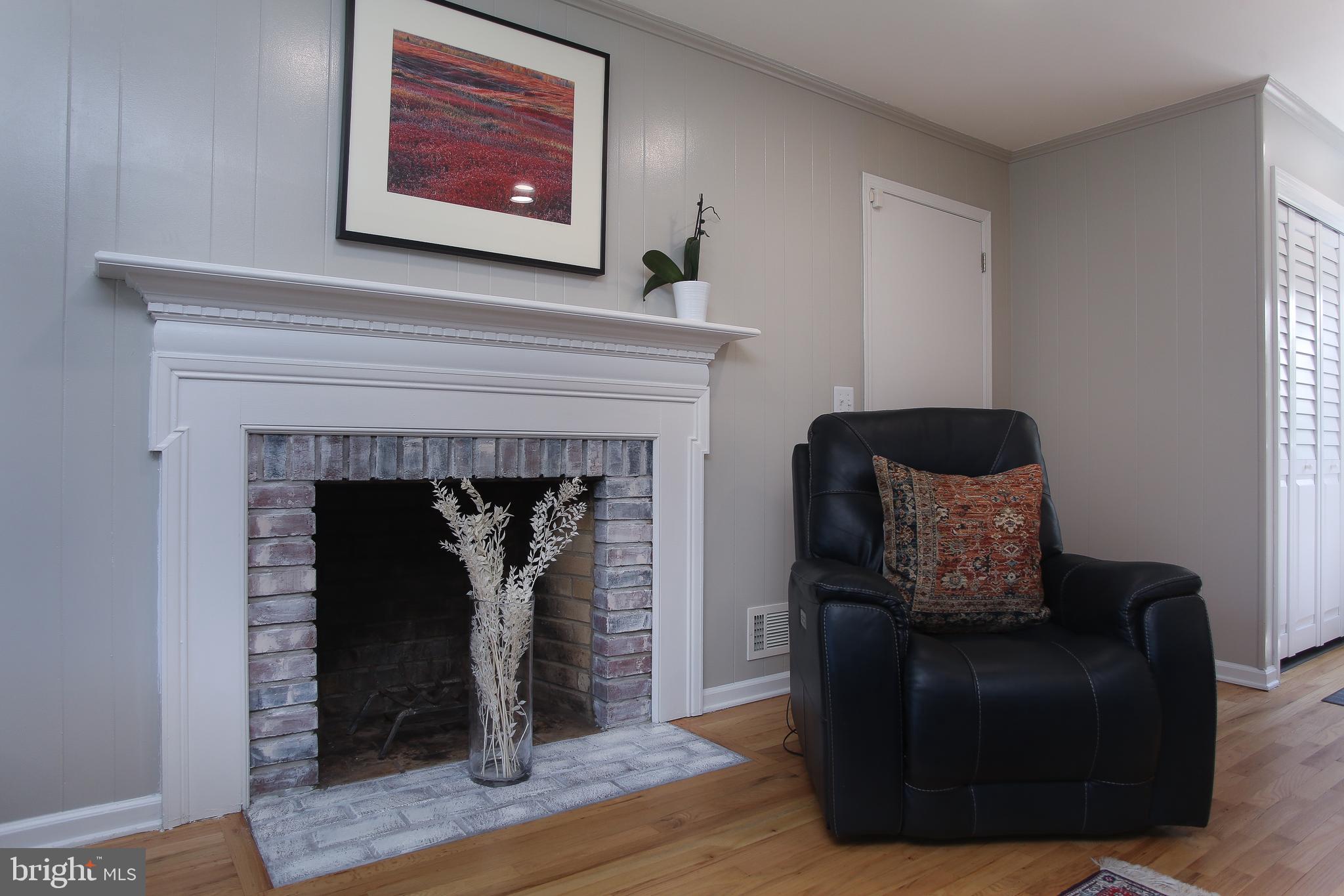 4 Indian Run Road Princeton Junction, NJ 08550 - Photo 14 of 43 a living room with furniture and a fireplace