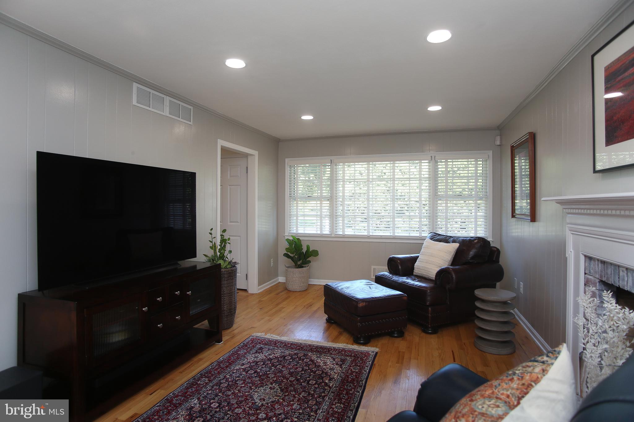 4 Indian Run Road Princeton Junction, NJ 08550 - Photo 15 of 43 a living room with furniture and a flat screen tv