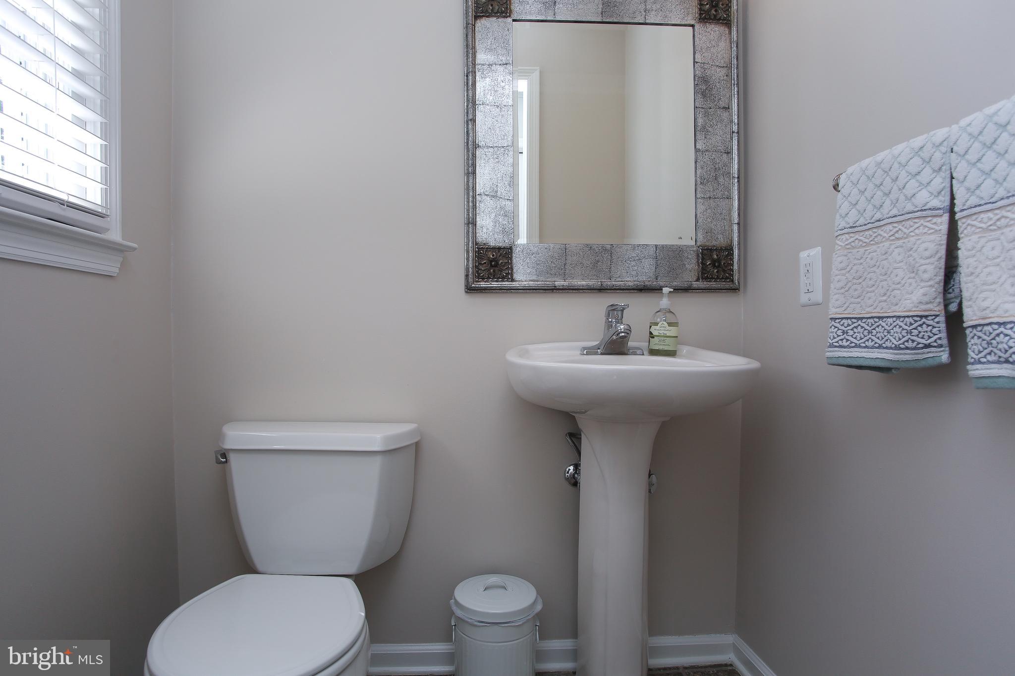4 Indian Run Road Princeton Junction, NJ 08550 - Photo 16 of 43 a bathroom with a toilet sink and mirror