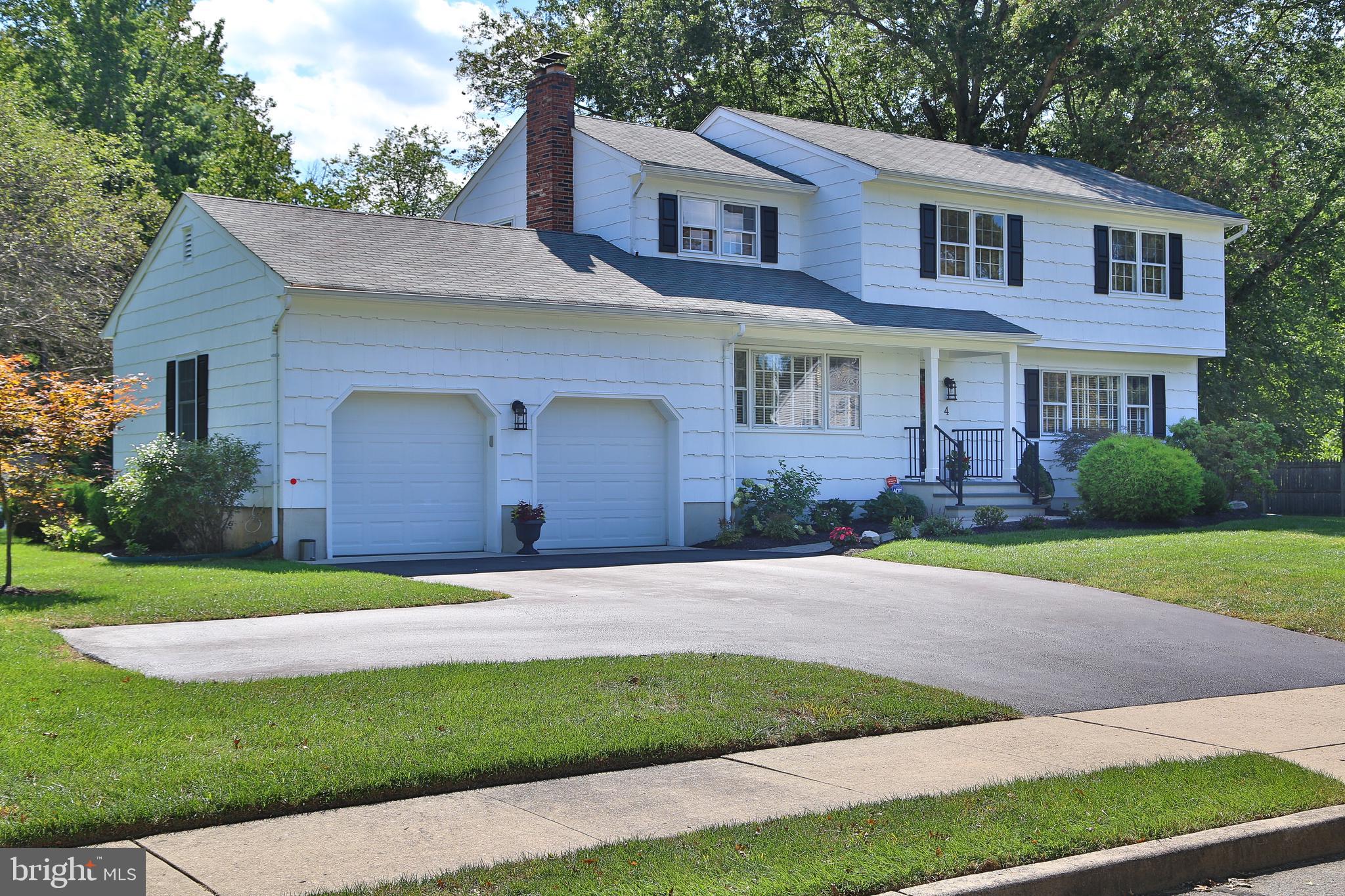 4 Indian Run Road Princeton Junction, NJ 08550 - Photo 3 of 43 a front view of a house with a yard and garage