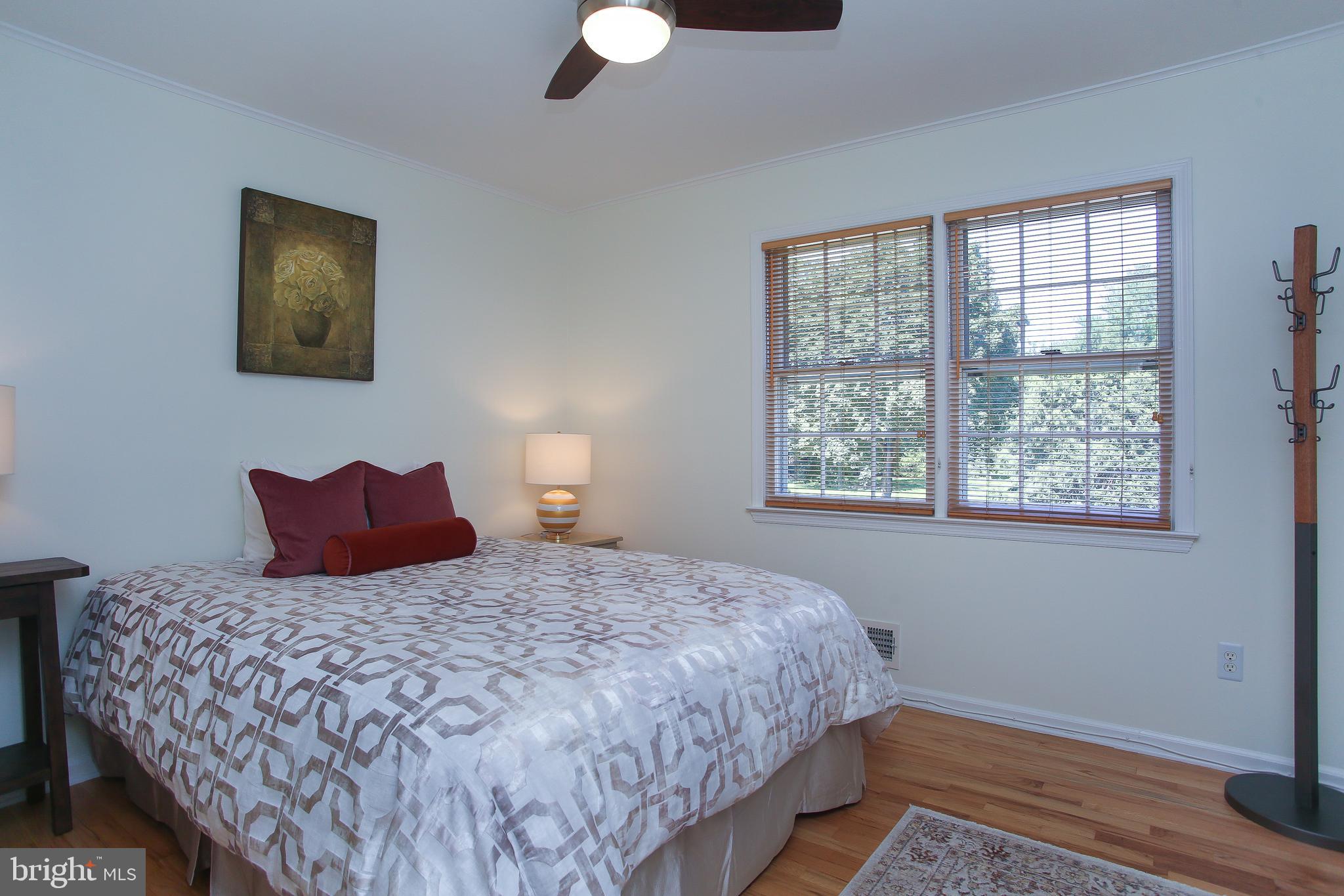 4 Indian Run Road Princeton Junction, NJ 08550 - Photo 22 of 43 a bedroom with a large bed and a window