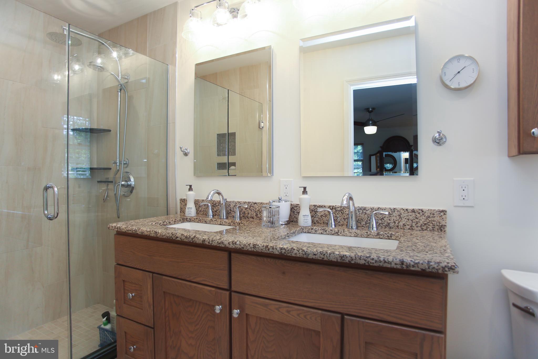4 Indian Run Road Princeton Junction, NJ 08550 - Photo 29 of 43 a bathroom with a granite countertop sink vanity and mirror