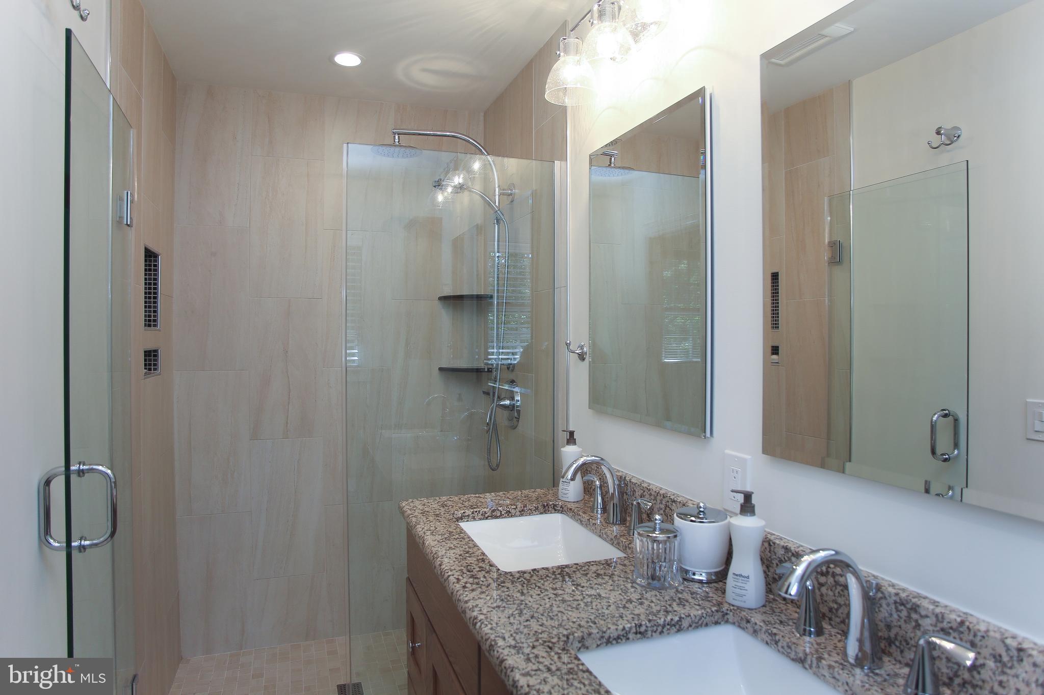 4 Indian Run Road Princeton Junction, NJ 08550 - Photo 30 of 43 a bathroom with a granite countertop shower sink and mirror