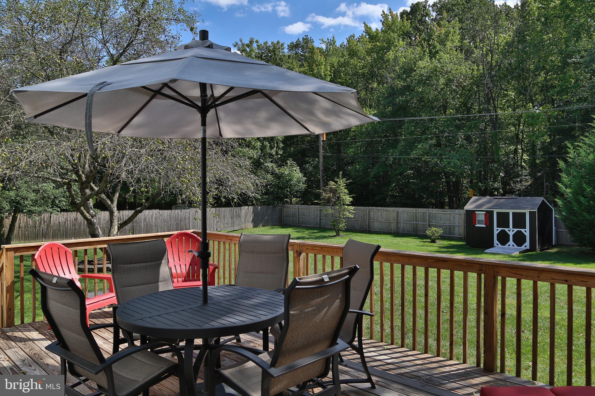 4 Indian Run Road Princeton Junction, NJ 08550 - Photo 37 of 43 a view of deck with furniture and umbrella