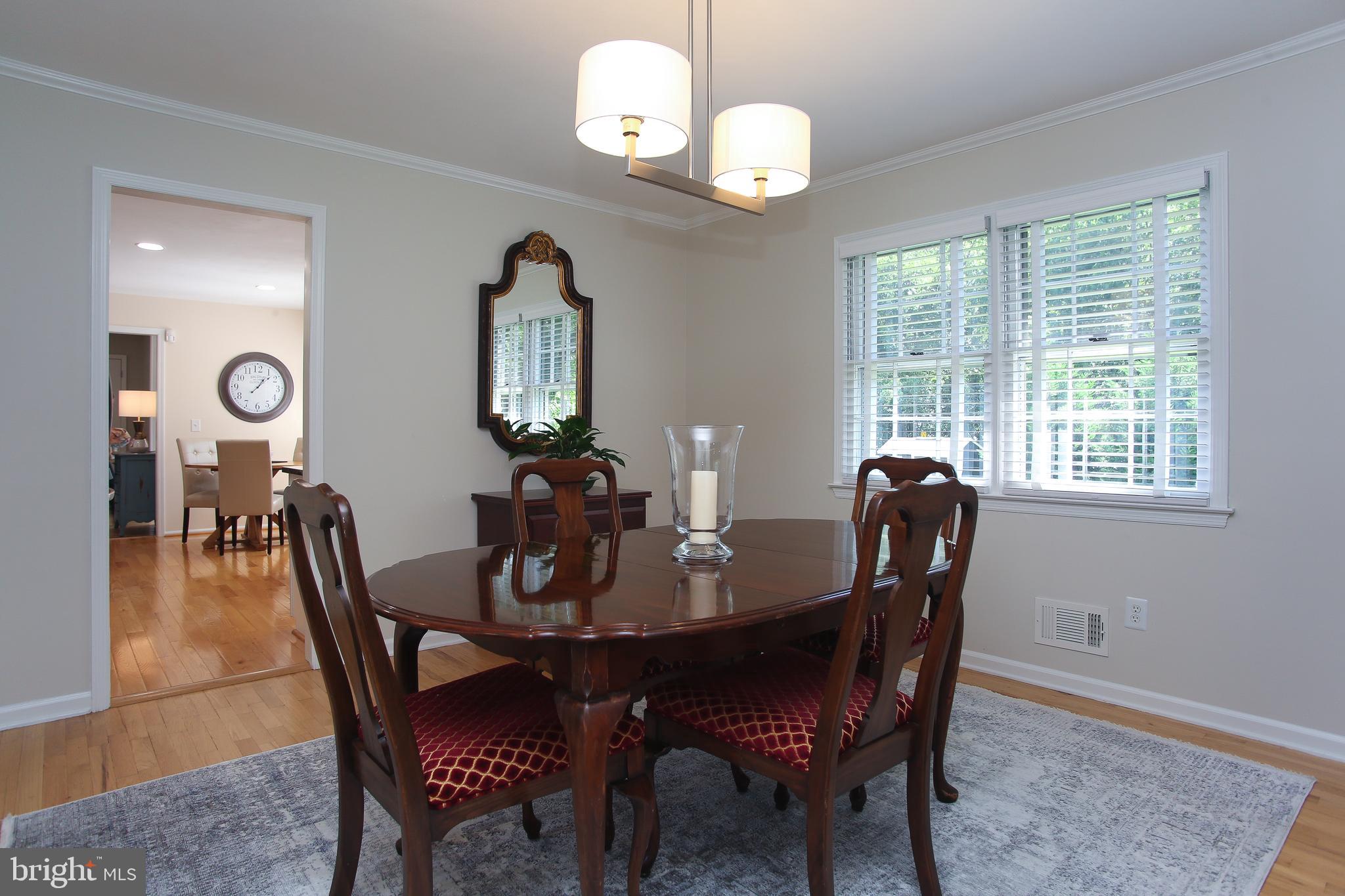 4 Indian Run Road Princeton Junction, NJ 08550 - Photo 8 of 43 a view of a dining room with furniture window and wooden floor