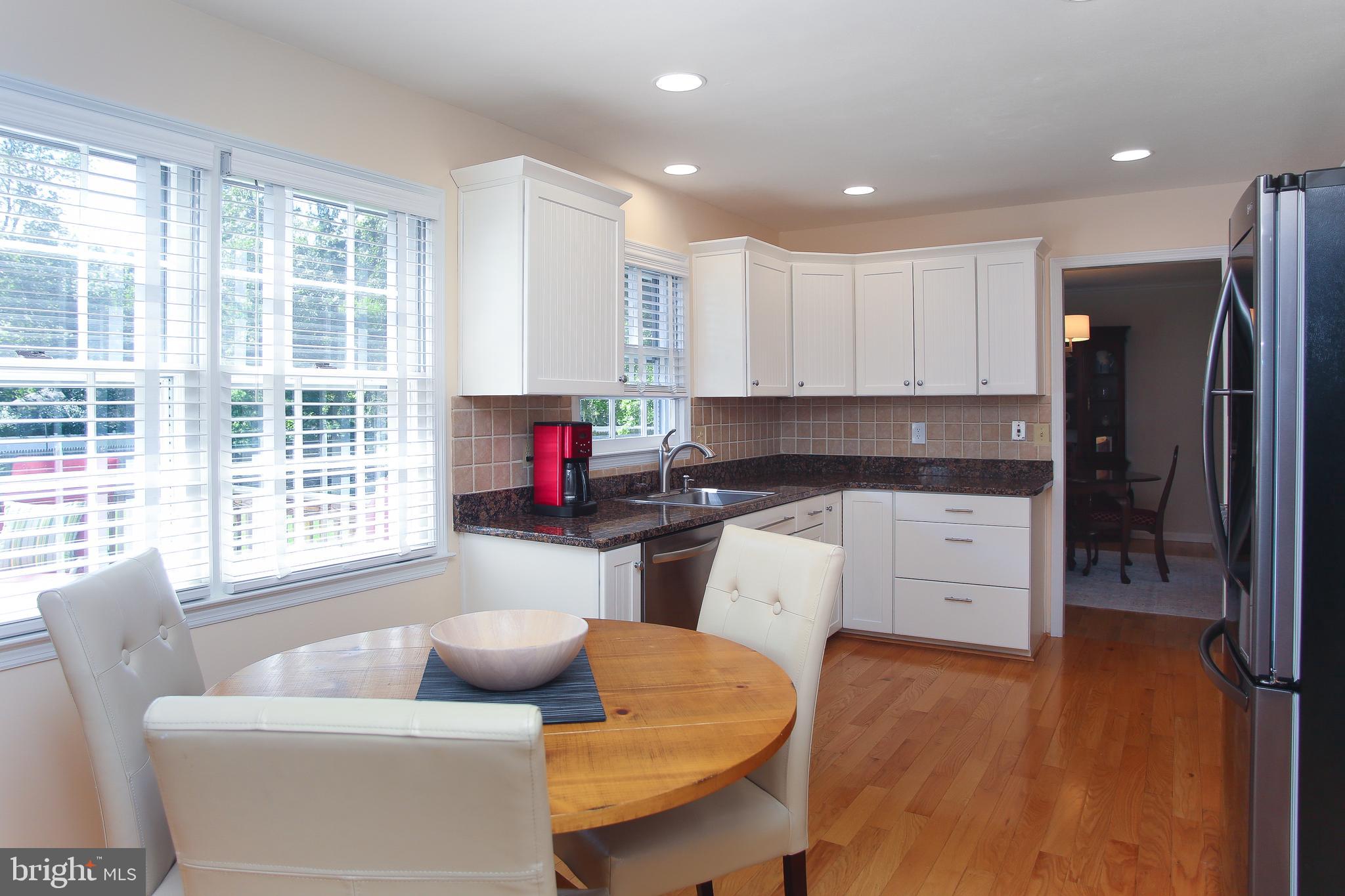 4 Indian Run Road Princeton Junction, NJ 08550 - Photo 9 of 43 a kitchen with stainless steel appliances granite countertop a refrigerator and a stove top oven