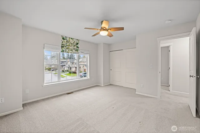 an empty room with windows and outdoor view
