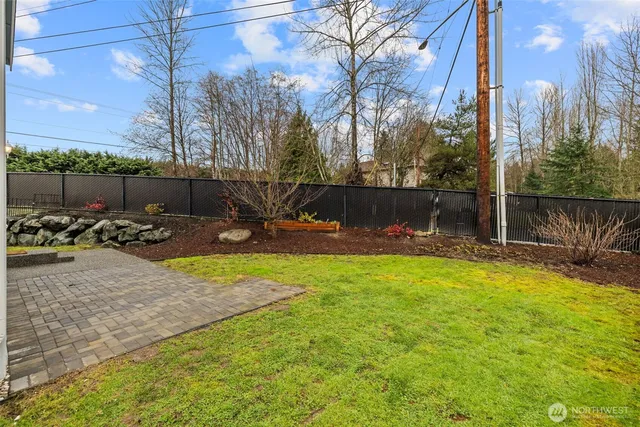 a view of a backyard of the house