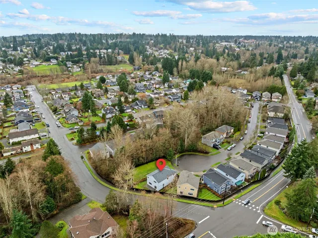 an aerial view of a houses with a lake view