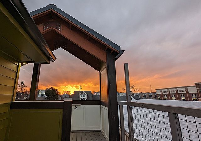 a kitchen with stainless steel appliances granite countertop a refrigerator a stove top oven a sink and dishwasher