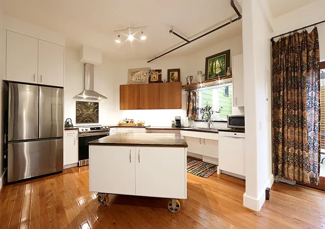 a white toilet sitting next to a bathroom sink