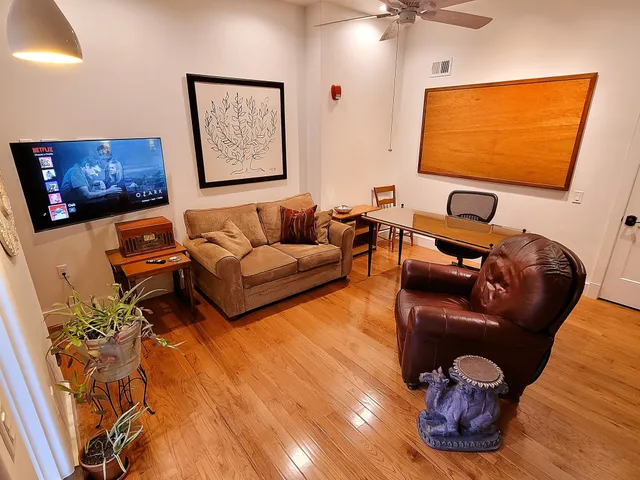 a view of a brick house with a large window
