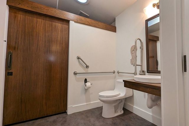 a kitchen with stainless steel appliances a stove and cabinets