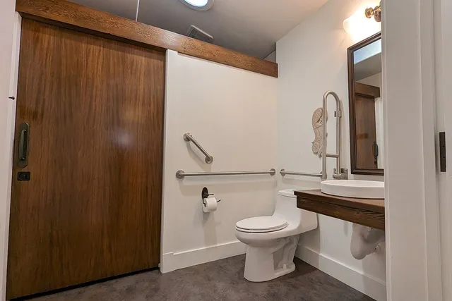 a kitchen with stainless steel appliances a stove and cabinets