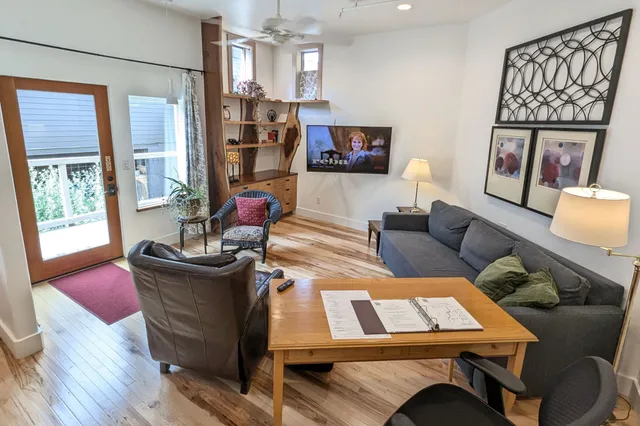 a view of path along with house and car parked