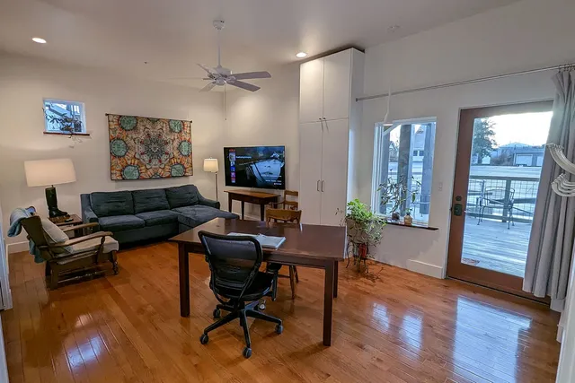 a kitchen with stainless steel appliances granite countertop a sink and wooden cabinets