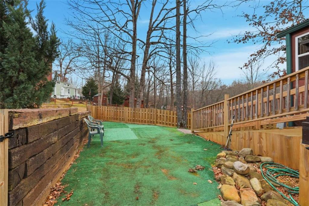 96 Stag Leap Drive Cleveland, GA 30528 - Photo 20 of 42 a view of a backyard with wooden fence
