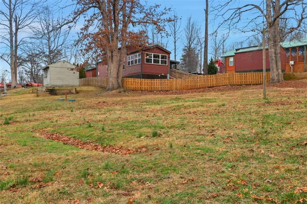 96 Stag Leap Drive Cleveland, GA 30528 - Photo 23 of 42 a view of a yard with wooden fence