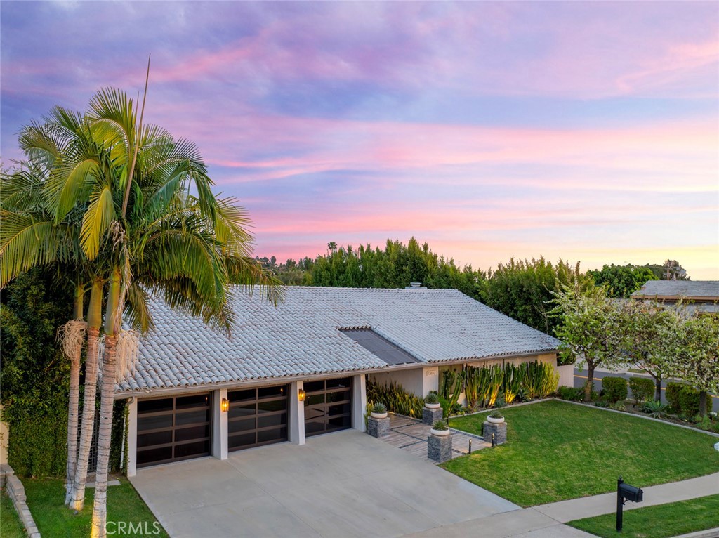 13692 Jenet Circle Santa Ana, CA 92705 - Photo 2 of 68 a view of a house with a yard and potted plants