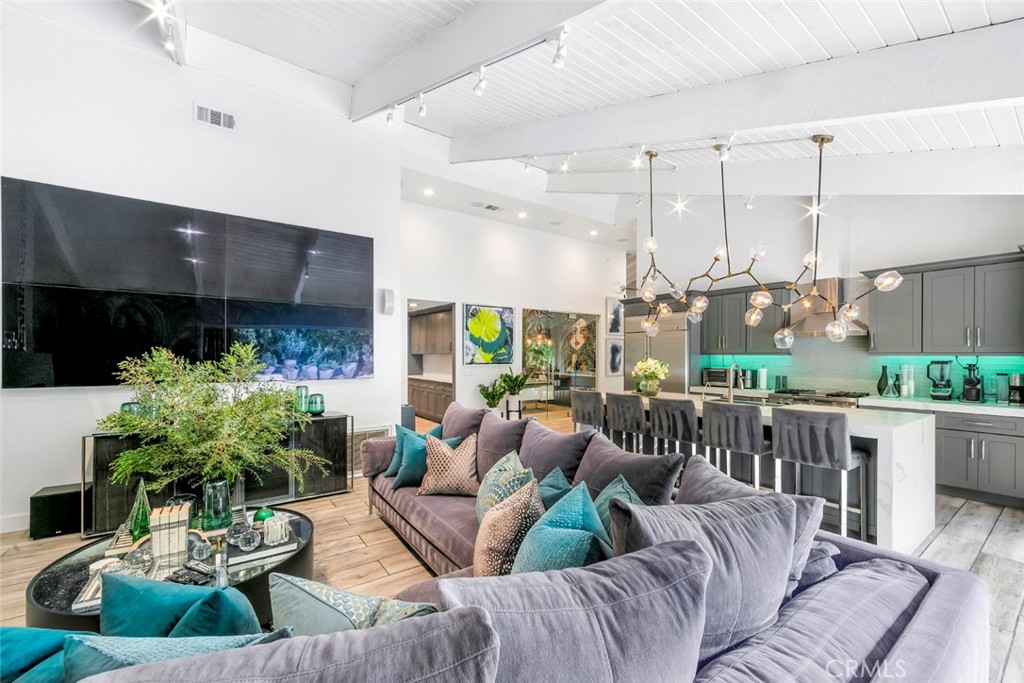 13692 Jenet Circle Santa Ana, CA 92705 - Photo 42 of 68 a living room with furniture potted plant kitchen view and a chandelier