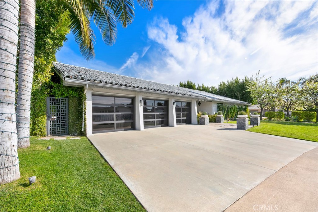 13692 Jenet Circle Santa Ana, CA 92705 - Photo 62 of 68 a front view of a house with a garden
