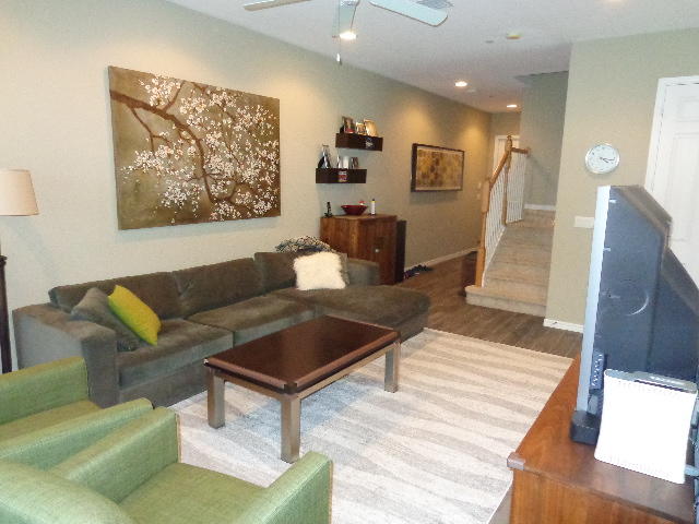 33 Lancaster Road Boynton Beach, FL 33426 - Photo 4 of 34 a living room with furniture and wooden floor