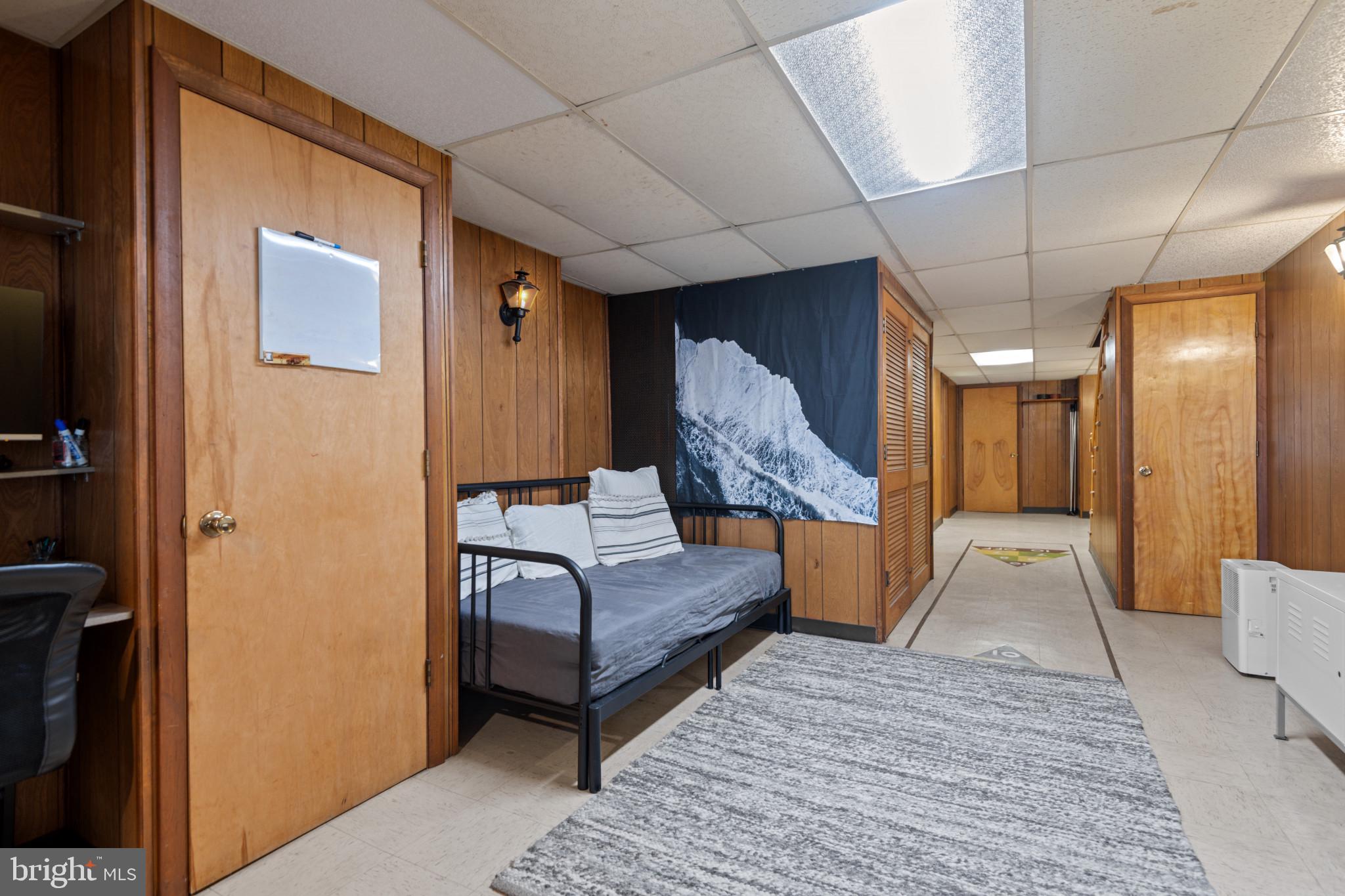 1228 West 37th Street Baltimore, MD 21211 - Photo 21 of 23 a bedroom with a bed and a couch