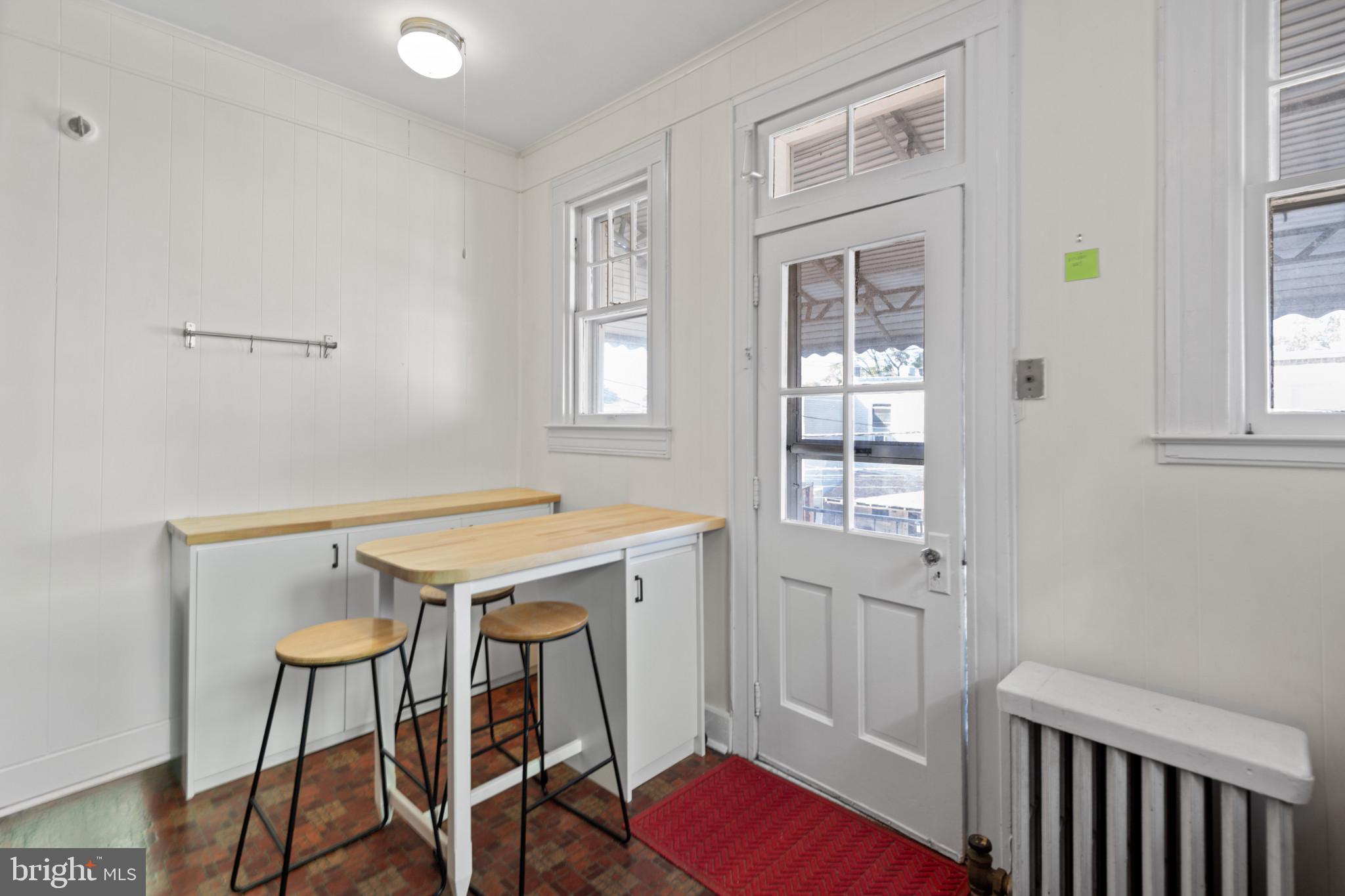 1228 West 37th Street Baltimore, MD 21211 - Photo 10 of 23 a view of a dining room with furniture and window