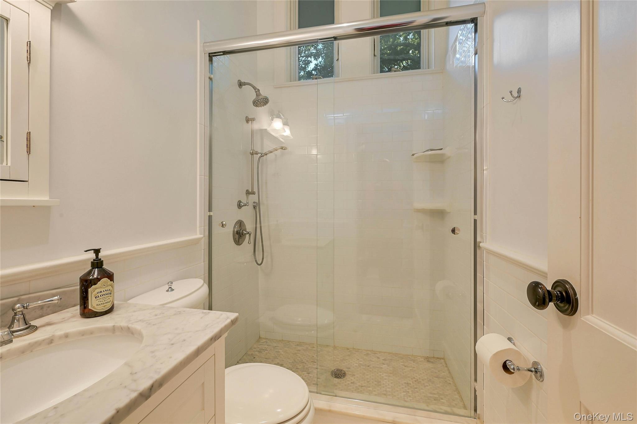 1600 Pine Tree Road Cutchogue, NY 11935 - Photo 15 of 27 a bathroom with a sink a toilet and shower