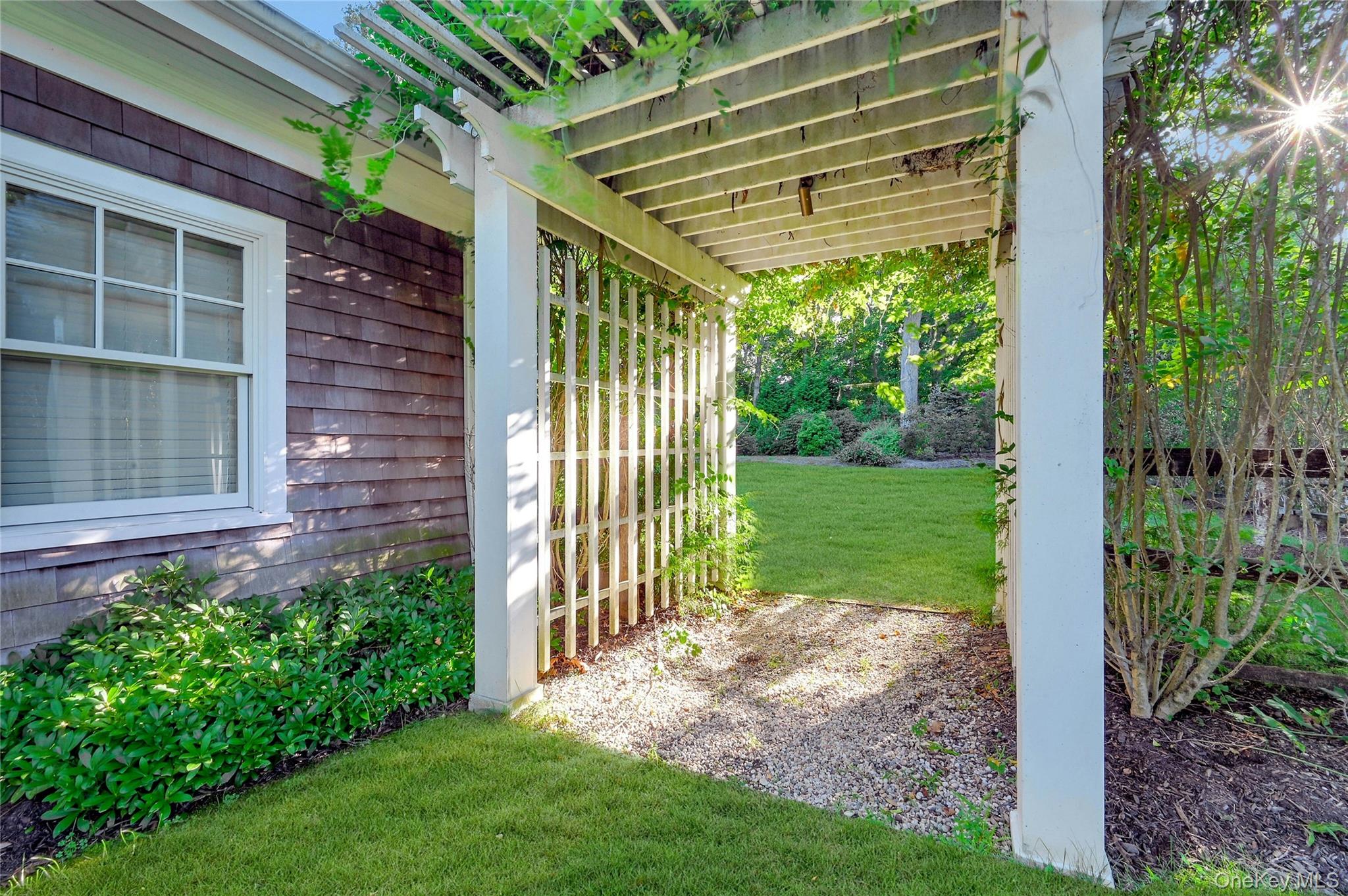 1600 Pine Tree Road Cutchogue, NY 11935 - Photo 23 of 27 a view of a backyard with plants and large garden