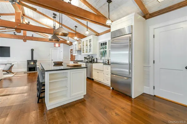 a kitchen with granite countertop stainless steel appliances and counter space