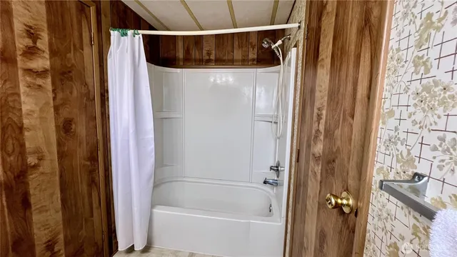 a view of workspace with wooden floor and windows