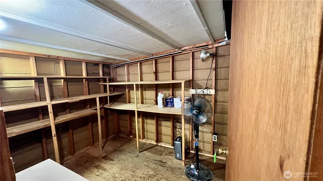 a kitchen with sink and cabinets