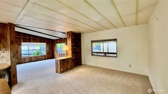 a view of livingroom with furniture and windows
