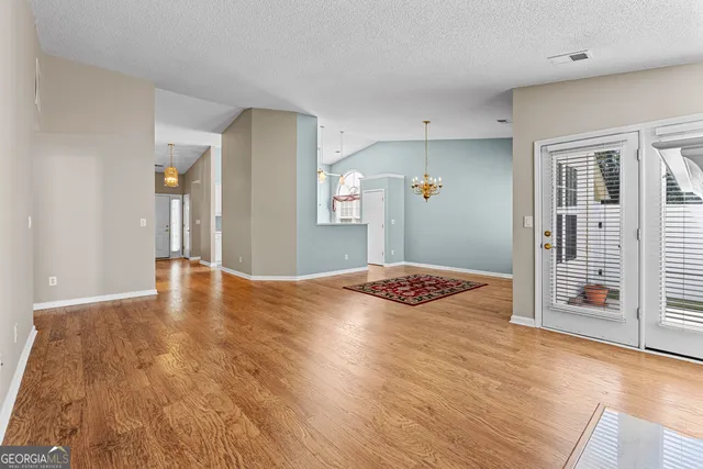 a view of a livingroom with wooden floor
